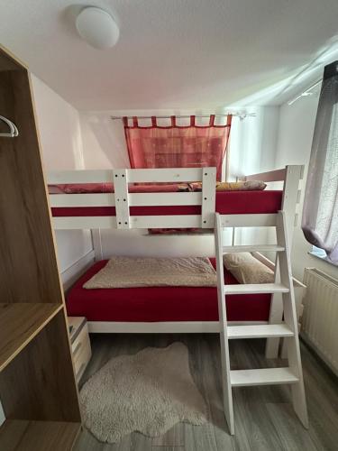 a couple of bunk beds in a small room at MemmingenBuxheimKartause in Buxheim