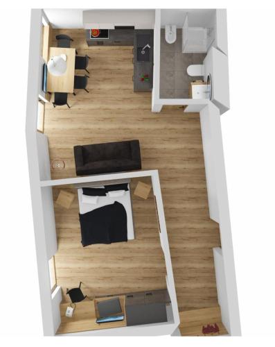 ein Grundriss eines Zimmers mit einem Bett in der Unterkunft Wonga Apartments in Gais