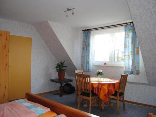 a room with a table and chairs and a window at Apartment Schule 5 by Interhome in Windeby