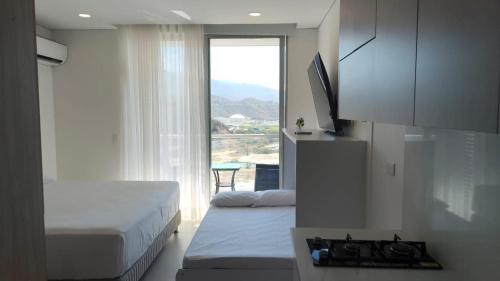 En eller flere senge i et værelse på Suite Pozos Colorados piso 14