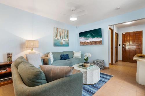 a living room with a couch and a table at Spacious Home with Private Pool & Covered Patio Near the Beach in Playa Flamingo