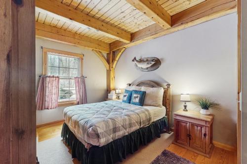 a bedroom with a bed and a wooden ceiling at Grouse Lane 12C in Dover