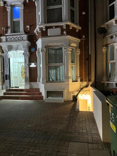 an empty street in front of a building at 525 Romford Rd, Fabulous Room in London