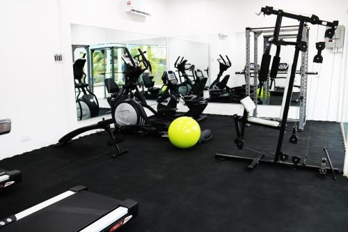a gym with several tread machines and a ball at EDC UUM Sintok in Sintuk