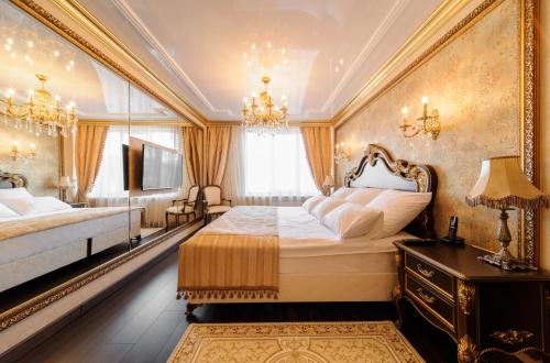 a large bedroom with two beds and a television at Hotel Barnaul in Barnaul