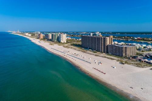 an aerial view of a beach with buildings and the ocean at Phoenix X 609 by Brett Robinson in Orange Beach