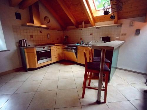 a small kitchen with wooden cabinets and a counter top at Apartment Jutta by Interhome in Guttenberg