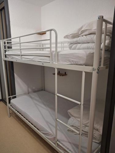 Giường trong phòng chung tại petit nid montagnard