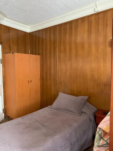 Llit o llits en una habitació de Hostal Dinamarca