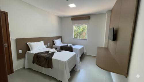 Giường trong phòng chung tại Sun Route Hotel