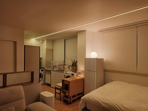 En eller flere senge i et værelse på Ansan Minimal Studio