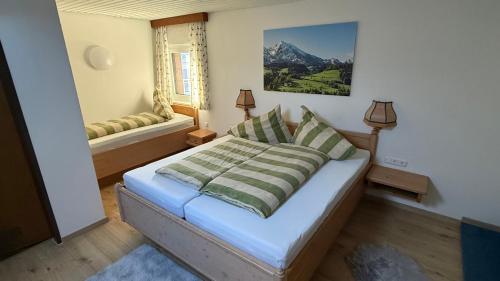 a small bedroom with a bed with a window at Botenwirt - Self Check in in Spital am Pyhrn