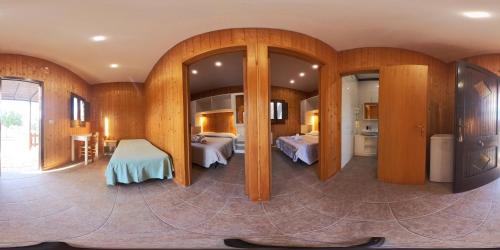 a room with two beds and two mirrors at La Carcara in Otranto