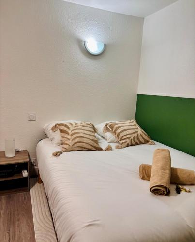 Postel nebo postele na pokoji v ubytování Escale Tropicale - T1 calme 5min à pied de la plage