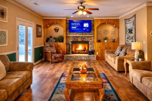 a living room with a couch and a fireplace at Mountainview Majesty in Gatlinburg