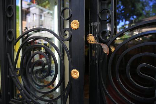 a group of black metal gates with nuts on them at Vila Sia in Bucharest