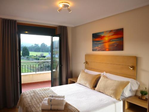 En eller flere senge i et værelse på Atico & Spa