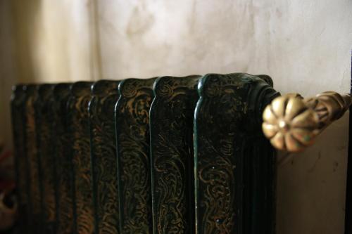 a close up of a black book with a gold knob at Vila Sia in Bucharest