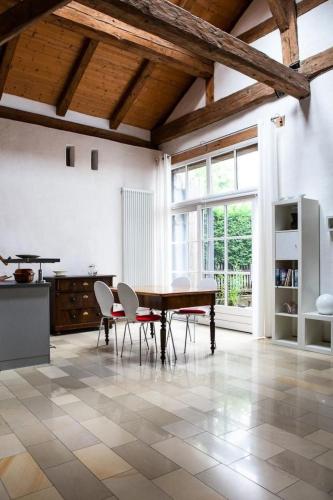 a kitchen with a table and chairs in a room at Apartment Studio by Interhome in Schernfeld