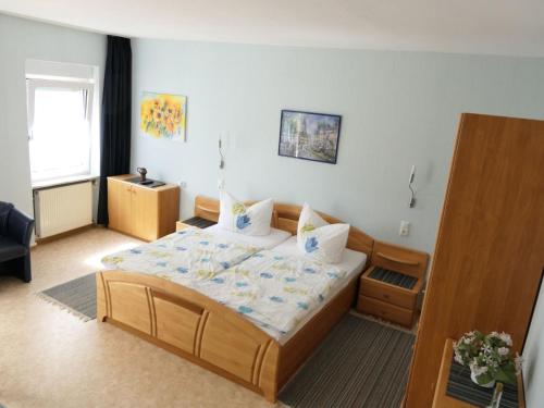 a bedroom with a large bed in a room at Apartment Haus Budinger by Interhome in Alf