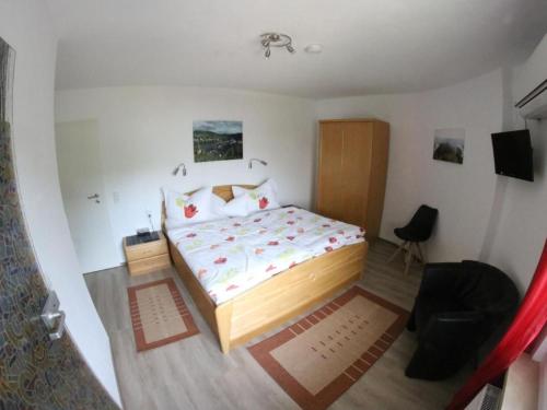 a bedroom with a bed in a small room at Apartment Haus Budinger by Interhome in Alf