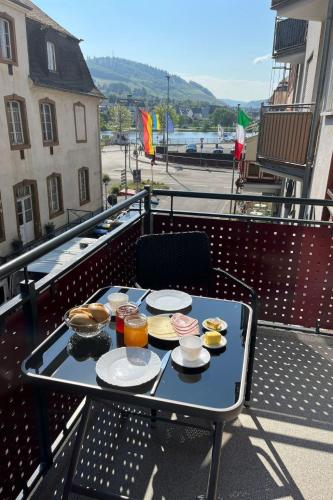a tray of food on a table on a balcony at Apartment Haus Budinger by Interhome in Alf