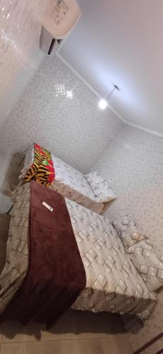 a bedroom with a large bed in a room at "Taberna dos Castilho" in Bertioga
