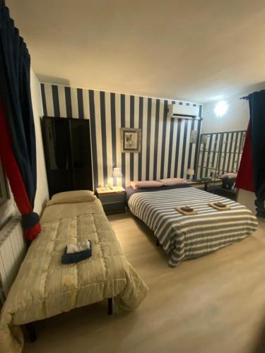 En eller flere senge i et værelse på Affittacamere La Quiete