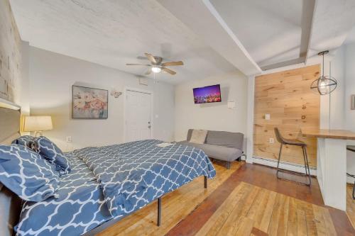 a bedroom with a bed and a ceiling fan at Cozy Private Suite in Worcester
