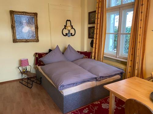 En eller flere senge i et værelse på Villa Marktresidenz