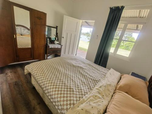 En eller flere senge i et værelse på Christian's Minde Jervis bay