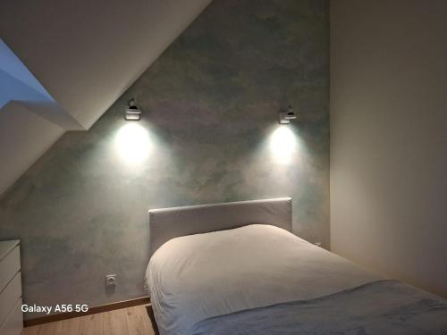 Een bed of bedden in een kamer bij Sur Les Roches