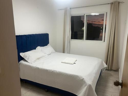 Postel nebo postele na pokoji v ubytování Despierta con Vista al Río, a Pasos de la Zona Colonial