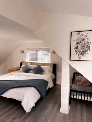 a bedroom with a large bed in a attic at Elmshade Villa in Vancouver South in Vancouver
