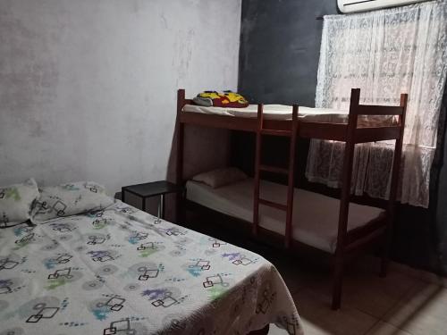 Llit o llits en una habitació de Marce Alojamiento