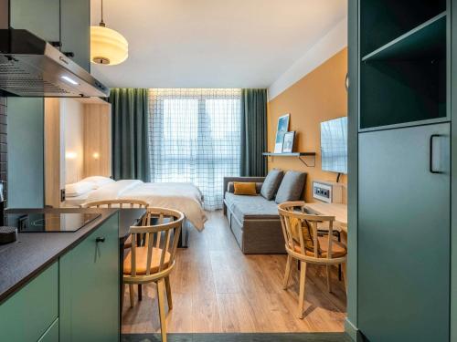 Giường trong phòng chung tại Aparthotel Adagio access Hamburg