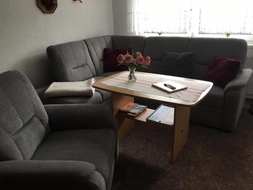 a living room with a couch and a coffee table at Ferienhaus Albrecht - ABC207 in Wismar