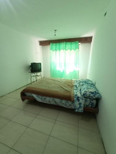 En eller flere senge i et værelse på La Casa de Martu