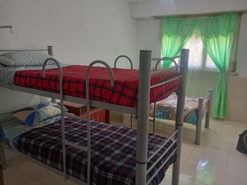 En eller flere senge i et værelse på La Casa de Martu