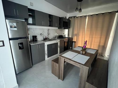 Kuchyň nebo kuchyňský kout v ubytování Home Sweet Home