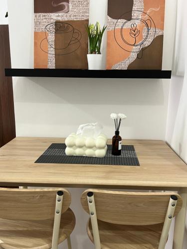 a shelf with a stack of towels on a table at JeMeCa Suites in Kauswagan