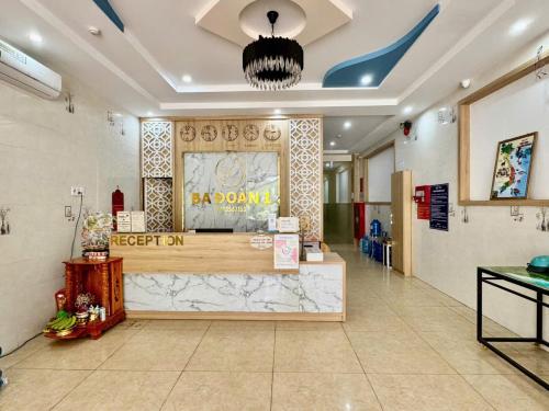 a lobby of a restaurant with a counter in a room at Khách Sạn Ba Đoàn 1 in Con Dao
