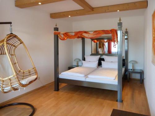 a bedroom with a bunk bed and a swing at City Hotel in Waldkraiburg