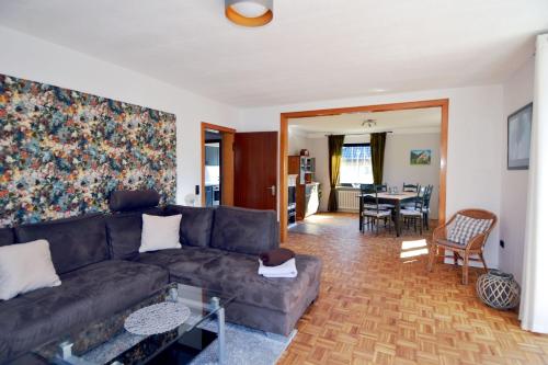 a living room with a couch and a table at Breslauer Haus in Heiligenhafen