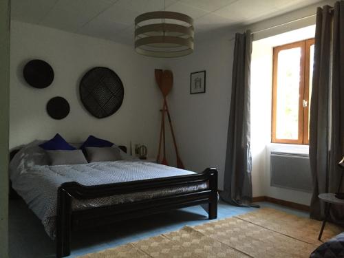 Postel nebo postele na pokoji v ubytování Gîte sur Loue