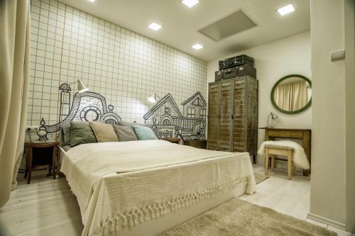 a bedroom with a bed and a tiled wall at Apartment near the Great Synagogue with FREE GARAGE in Budapest