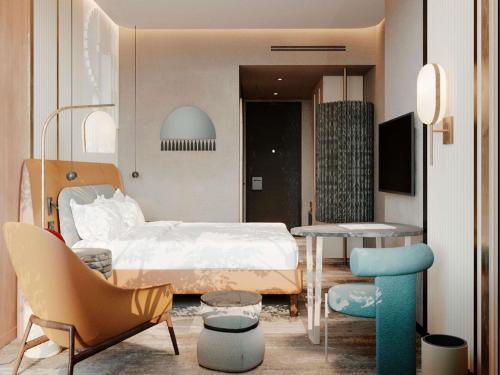 Kama o mga kama sa kuwarto sa Mövenpick Yerevan
