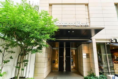 a view of the entrance to a building at Richmond Hotel Tokyo Shiba in Tokyo