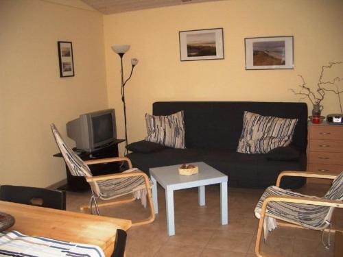 Et opholdsområde på "Ferien Nord-Nordost" Wooster Teerofen "Am Walde" Ferienhaus Komfort