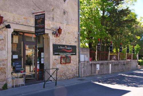 a building with a sign on the side of a street at Le Bistrot Vinaigrette in Prades-le-Lez
